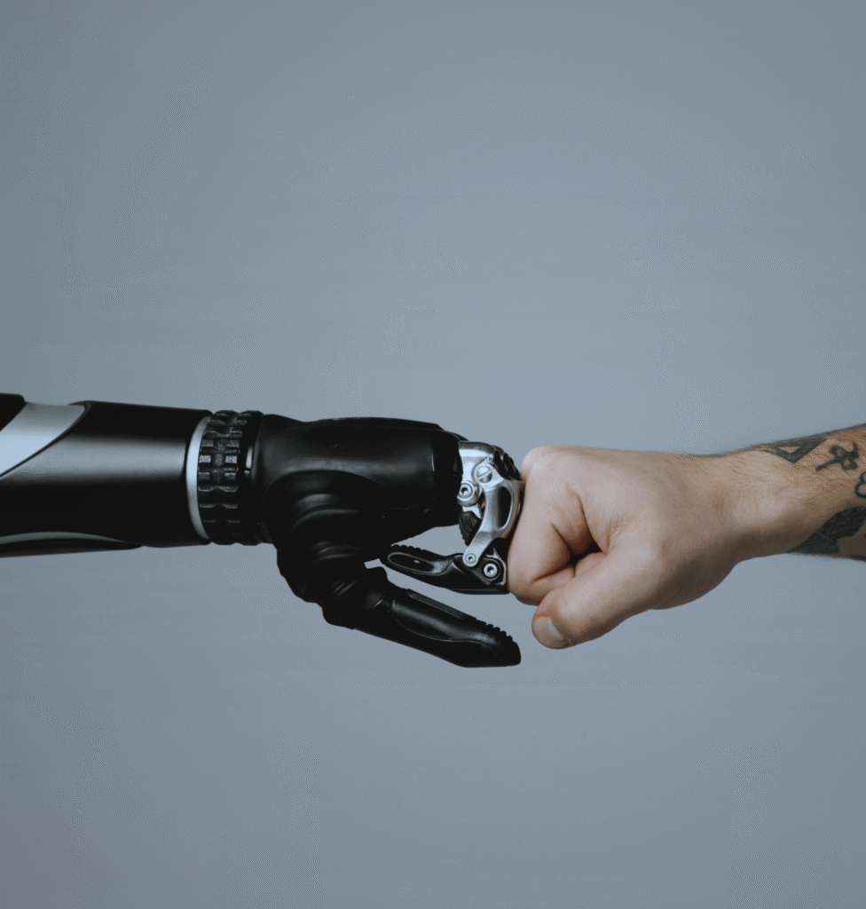 A human hand and a robot hand bumping fists signifying a mutual relationship between technology and humans.